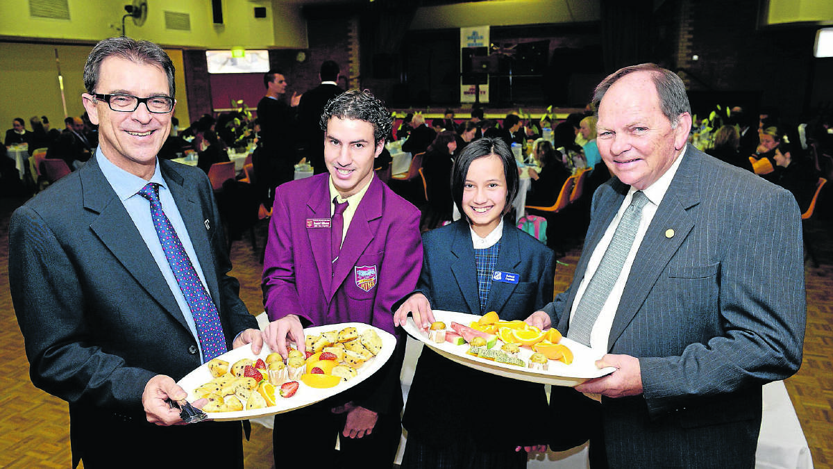 FOOD FOR THOUGHT:  Council general manager  David Evans and mayor Peter Blackmore at yesterday’s Local Government Week Breakfast with Rutherford High vice-captain Daniel Gibson and Myra Paleologos, Bolwarra Public School captain.  	Picture by STUART SCOTT