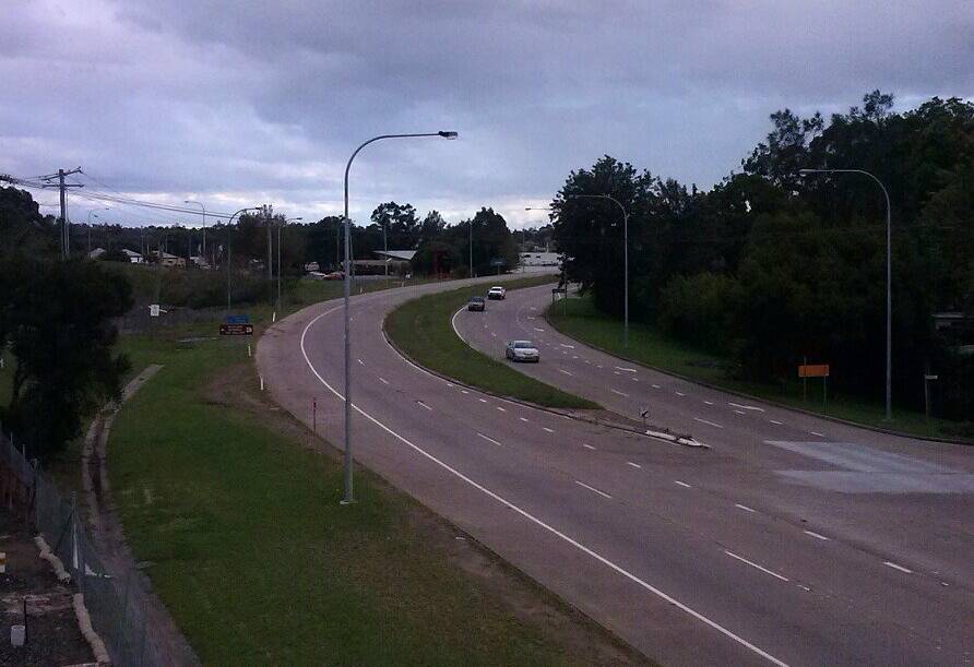 REOPENED: Photo of the first cars driving on the New England Highway south of the Church Street roundabout in Maitland since it was closed on Friday.  Picture by Ricky Bush