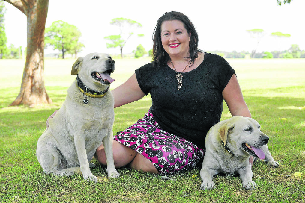 DISGUSTED: Jaime Abbott, pictured with her much loved labradors, has seen fist hand the result of human neglect towards animals. 	Picture by STUART SCOTT 