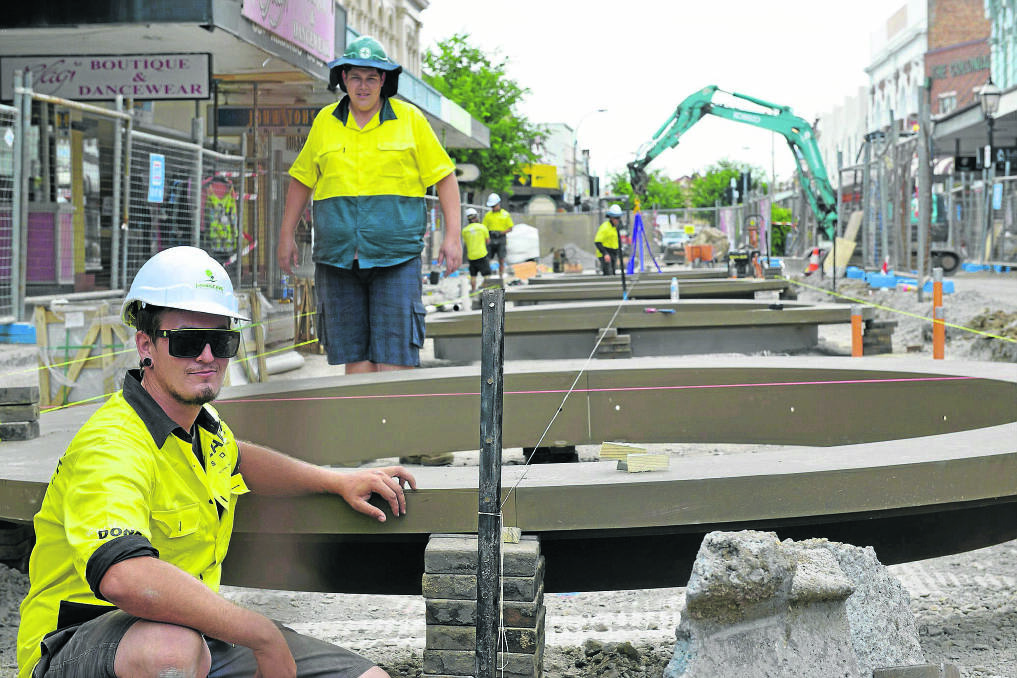 Construction workers in The Levee precinct in central Maitland.