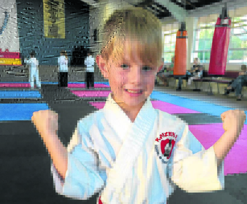 DETERMINED:  Charlie Goodwin, 5, has obtained his red belt. Picture by: ALAN HARDIE