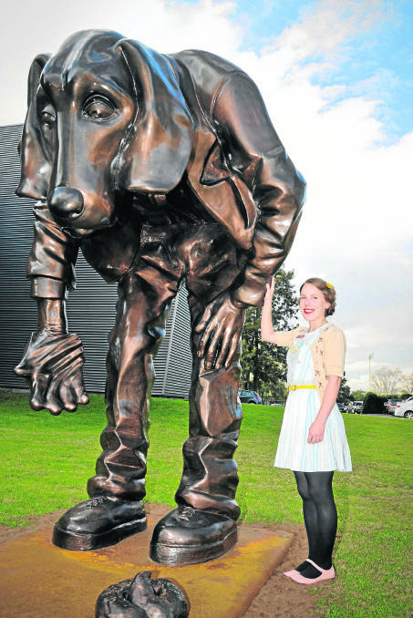 LIKE NEW:  Fetch Boy is back, taking pride of place in the grounds of Maitland regional Art Gallery, pictured with Anna Soldal.  	Picture by PERRY DUFFIN 220714PD069 