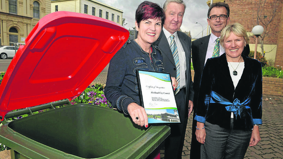 NEW INITIATIVE:  Member for Maitland Robyn Parker with deputy mayor Steve Procter, council general manager David Evans and council’s waste services co-ordinator Elfi Blackburn with one of the new bins.   	Picture by STUART SCOTT