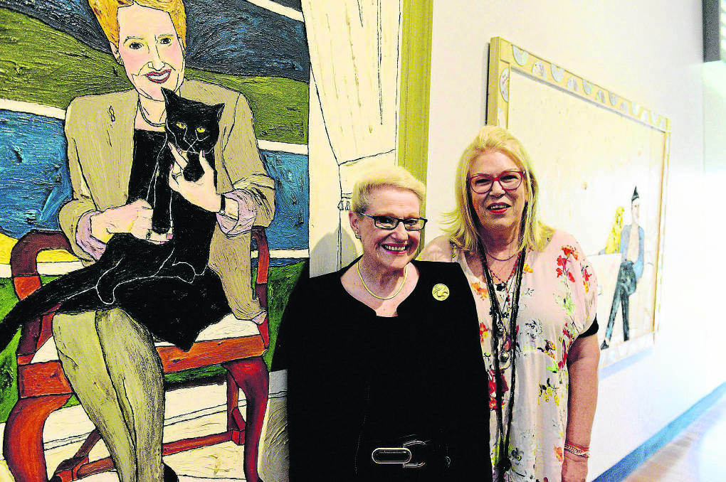 DOUBLE TAKE:  Speaker of the House of Representatives Bronwyn Bishop with her portrait and its artist Kerrie Lester at the Maitland Regional Art Gallery. 	Picture by PERRY DUFFIN 280215PD02