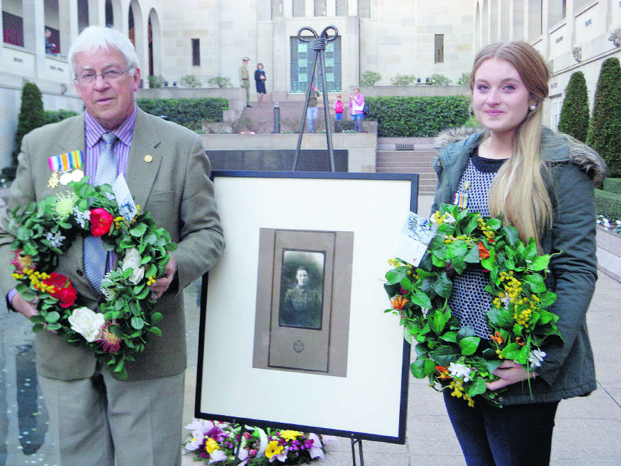 MOVING MOMENT:  Charlotte Lambert and Robert Worboys beside a photograph of Sergeant Arnold Lambert Worboys. 	Picture by RAMONA COCCO