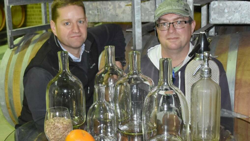 Barossa Distilling Company's Neil Bullock and Stuart Bourne with some of the handblown JamFactory magnums for the Generations Gin first release.