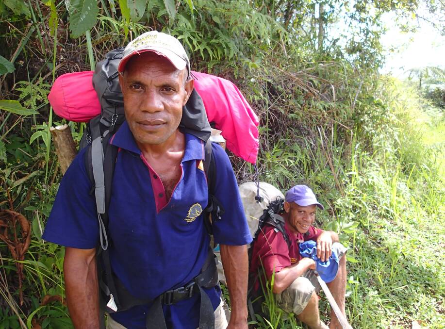 Papua New Guinean porters are on hand to help with carrying packs and negotiating  log bridges. PHOTO Loredana  Citraro. 