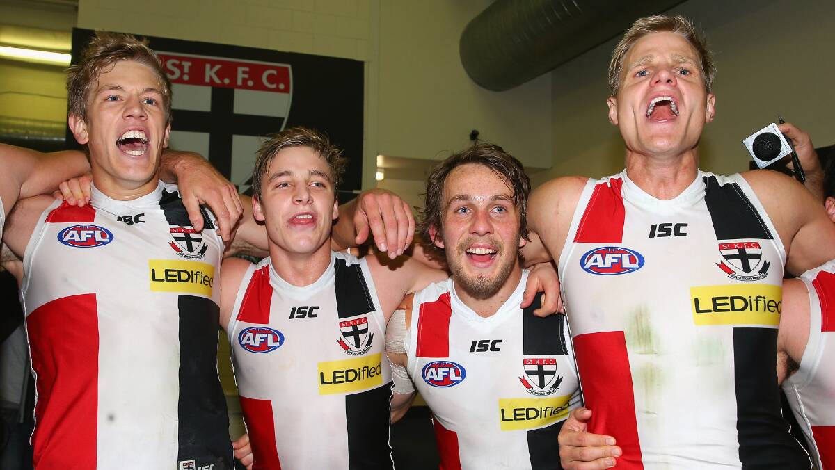 Rhys Stanley, Luke Dunstan, Josh Saunders and Nick Riewoldt of the Saints sing the song in the rooms after winning the round five AFL match between the Essendon Bombers and the St Kilda Saints at Etihad Stadium on April 19, 2014 in Melbourne, Australia. Photo: Quinn Rooney/Getty Images.