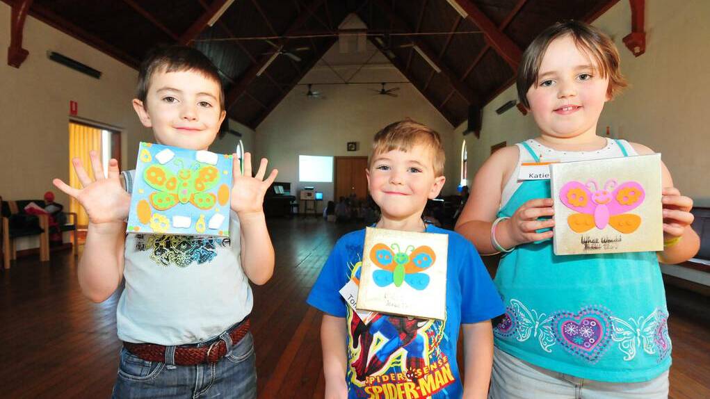 DUBBO: Siblings Will, Tom and Katie McCullough with their Easter butterfly artworks. Photo: Louise Donges/The Daily Liberal.
