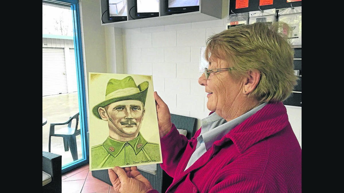 FOUND HIM:  Christine Barrett with the portrait of her grandfather whose grave she managed to locate in Turkey.  