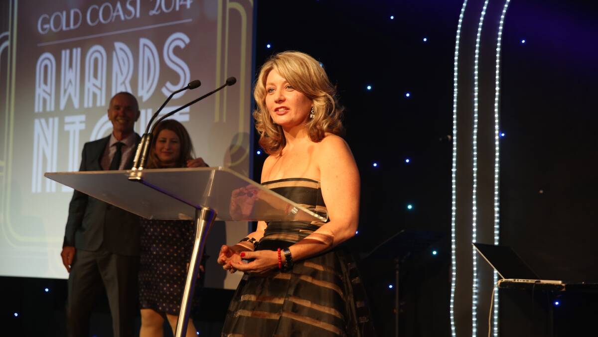 NATIONAL RECOGNITION:  Liz Trotter accepts her national award for Women and Financial Planning for 2014.