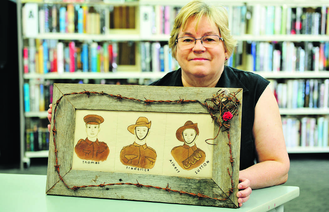 HEARTFELT WORK:  Maitland Embroiderers president Joey Thelander with one of the works from the Anzac Challenge which will be exhibited at Tocal Homestead in September.	Picture by CATH BOWEN 