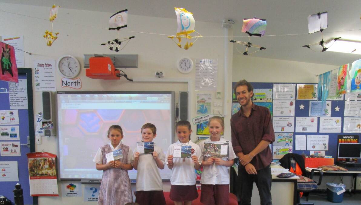 EXCELLENCE: Rutherford Public School students Teea Porter, Nicholas New and Teleah Clarke were highly commended in a Sculpture in the Vineyards competition while Ella Crocket received the overall prize from artist Mark Swartz.
