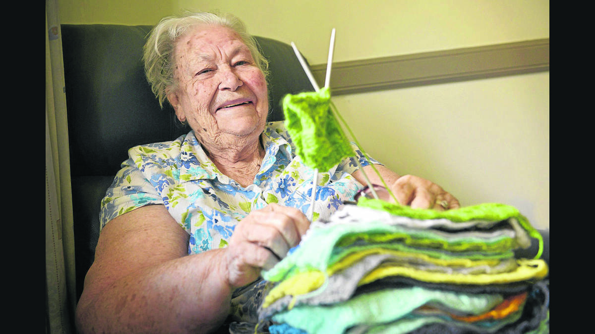 KEEPING ACTIVE:  Betty Richardson who is knitting to help produce rugs for the homeless.       	Picture by STUART SCOTT 