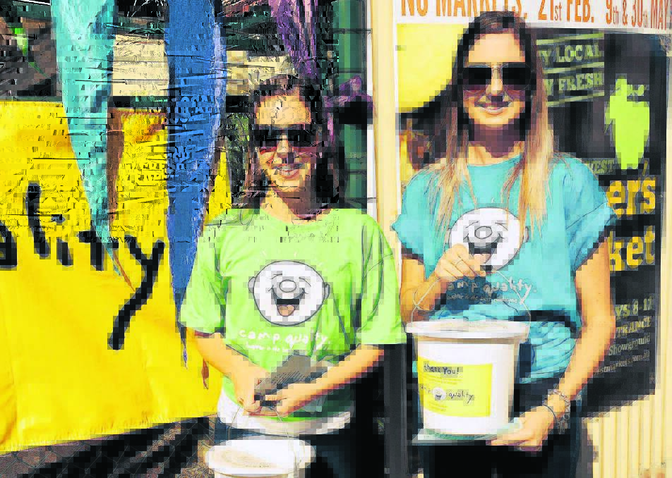 FUNDRAISER: Ally Crocker and Brook Melzer collect money for Camp Quality at the Maitland Harvest Markets.