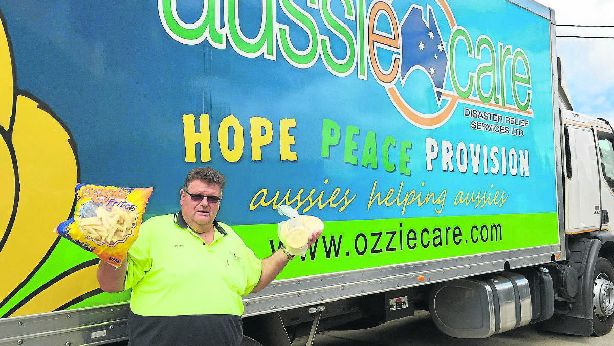 CHARITY DRIVE: Aussie Care national director Peter West with some of the food he was preparing to transport north last week. 	Picture by ALAN HARDIE