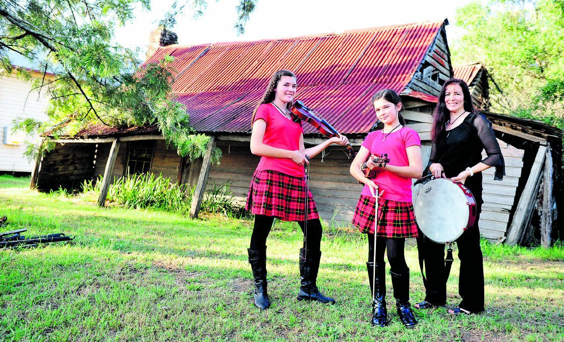 SWEET SOUNDS:  Pumpkin Juice band members Gabi  and Olivia Blissett and Jenny Roberts tune up for the Woodville concert.  