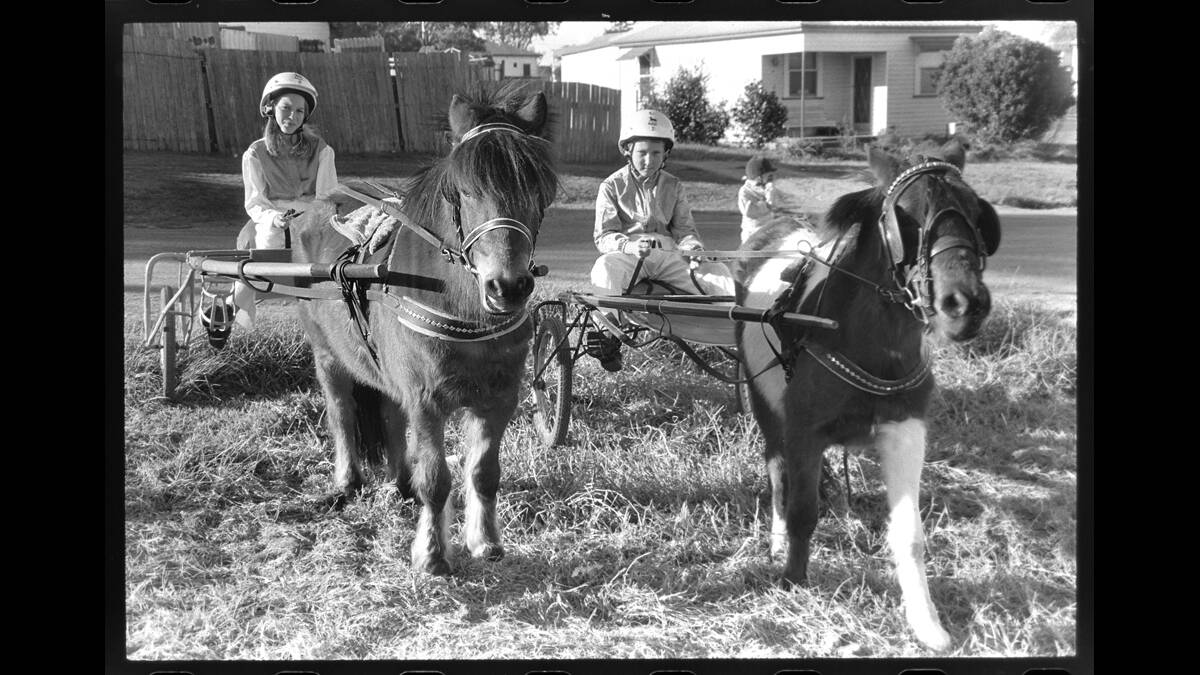 LEFT: Here’s ­another old photo­ from the Mercury’s archives. If ­anyone knows the young trot drivers in this image, please call Josh Callinan on 4931 0125. 