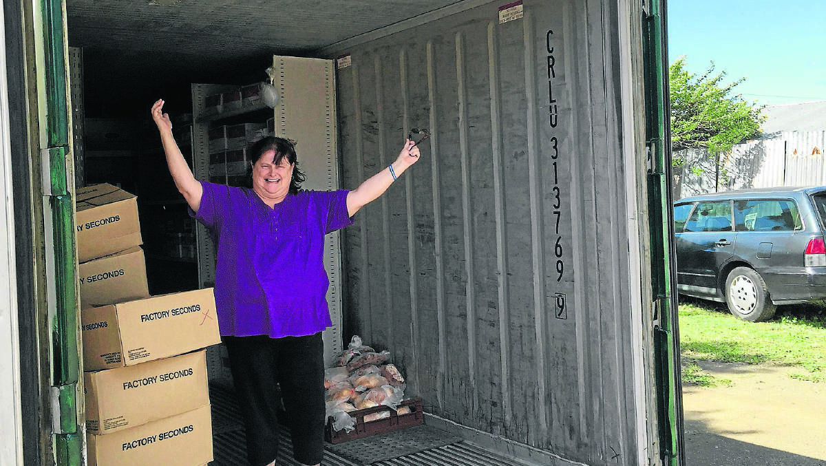 THANK YOU: The Food War owner-manager Elsie Cooper inside the new freezer.  	Picture by ALAN  HARDIE