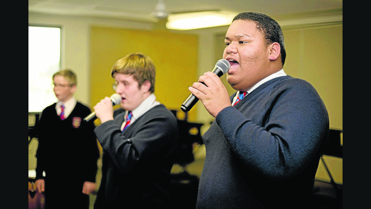 RIGHT ON SONG:  Choir member John Leao, 15.   	Picture by PERRY DUFFIN 
