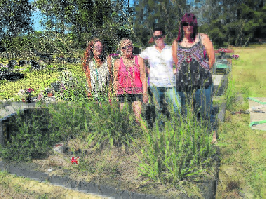 UPSET:  Kym Gibbs, Isabel Farley, Leesa Taylor and Kylie Olariaga at East Maitland Cemetery.  	Picture by ALAN HARDIE 