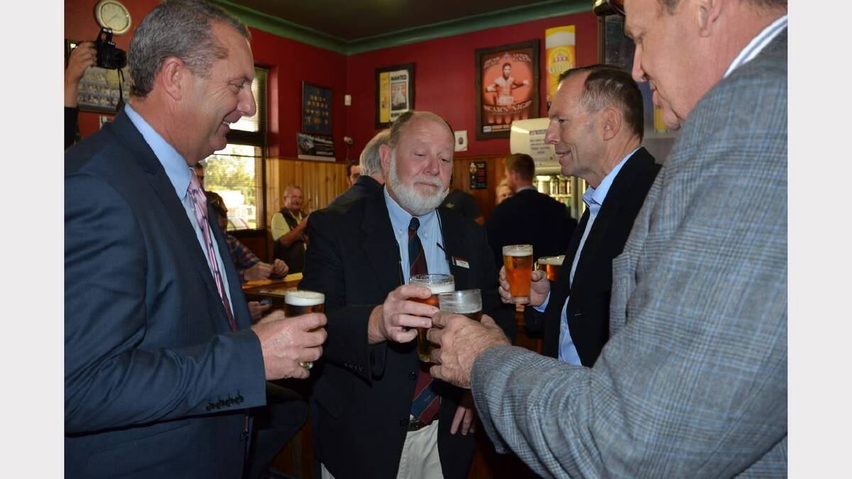 Mr Abbott (second from right) having a beer with State Member for Upper Hunter Michael Johnsen, Dungog councillor Glenn Wall and Federal Member for Paterson Bob Baldwin
