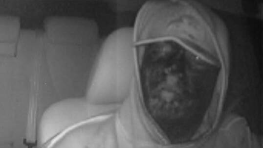 CCTV image of a man who allegedly coloured his face with a marker pen before robbing a taxi driver at Rutherford. 