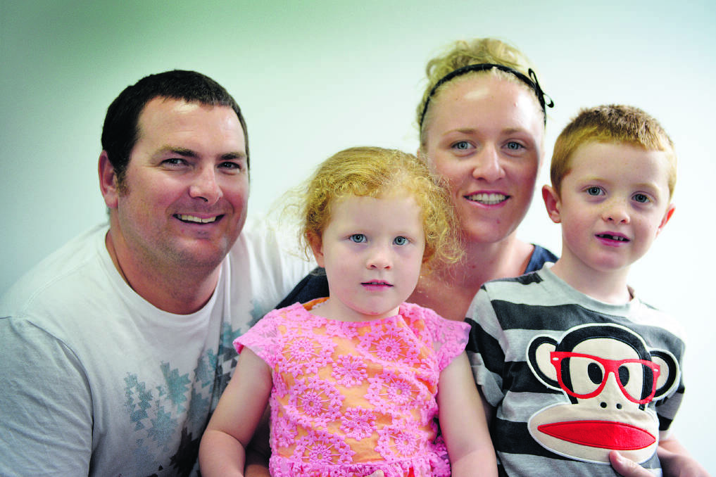 PEACE OF MIND: David and Melissa Griffiths with their children, Libby, 3, and Riley, 5.  	Picture by CATH BOWEN