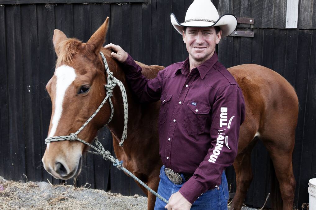 CHAMPION AND AUTHOR:  Four-time Australian Bullriding Champion Brad Scott, ­pictured on his father’s farm in Kundabung, has written a book about his sport. 	Picture by RUSSELL PELL