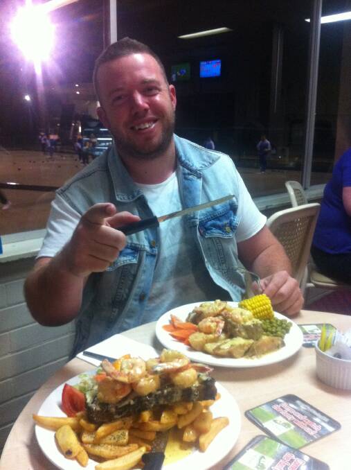 BIG FEED: Maitland legend Mitch Power enjoys the Beef and Reef at Maitland Park Bowling Club.