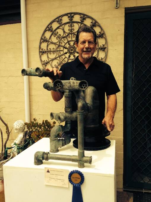 FIRST PRIZE:  Sculptor Stephen Shoebridge with the entry that won him first prize of $600 in the Maitland Region Society of Artists annual exhibition.