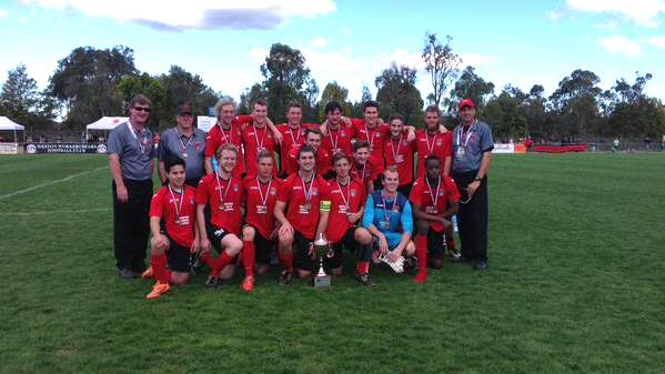 Thornton Redbacks under 23s pose for a team photo with their grand final medallions