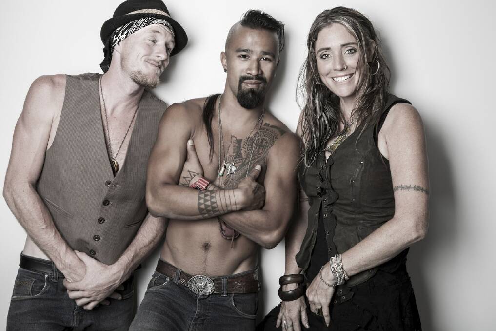 UNIFYING CULTURES:  Nahko Bear (centre) with his band who play in Newcastle this month.