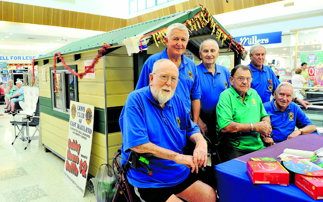 COMMUNITY WORK: East Maitland Lions Club members (back) Gary Parsons, Paul Logue, Doug Frost, (front) Fred French, Keith Martin and Wal Sellers with the cubby house at Stockland Green Hills before Christmas.  	Picture by PERRY DUFFIN