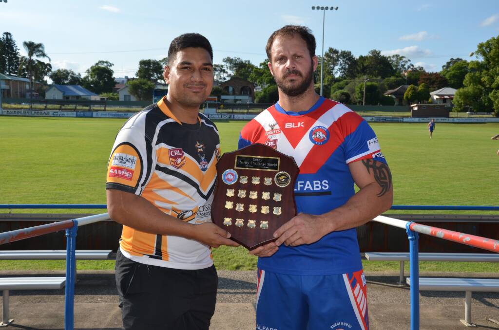 IT’S ON:  Cessnock’s Alec Fata and Kurri’s Mick Campton with the charity shield, which the two sides will contest this Saturday.