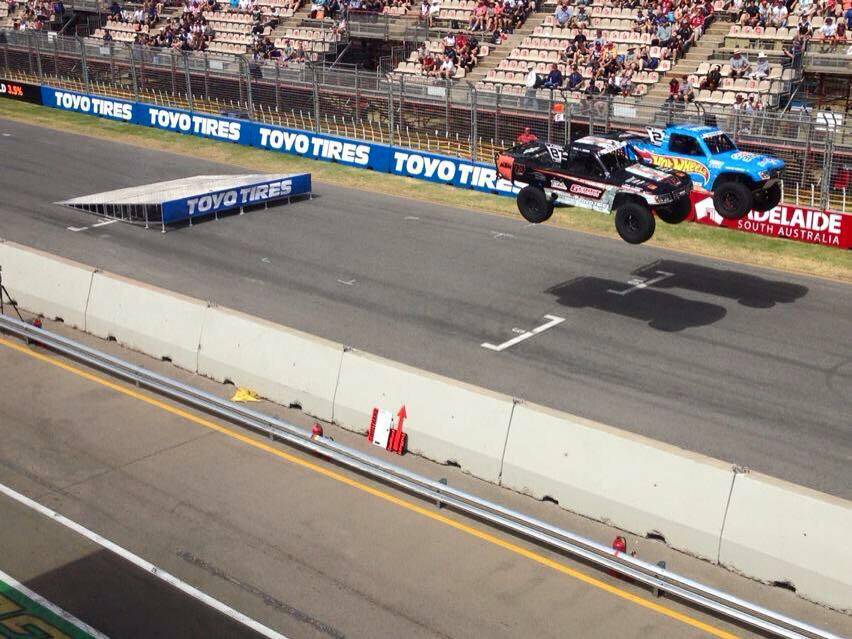 Toby Price (left) gets some air in his Super Truck.
