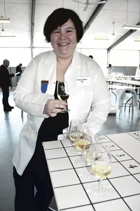 DROPS TO DRINK:  Internationally renowned wine judge Fongyee Walker tastes drops at the Hunter Valley Wine Show.	Picture by LOUISE NICHOLS