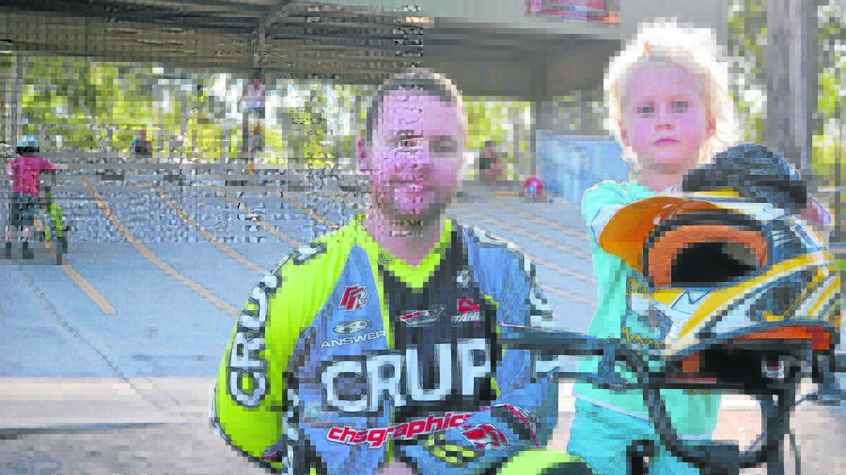 READY TO RACE: Maitland Tenambit BMX Club vice-president Pat Enright with new member Mitchell Gordon, 5, of Paterson. Picture by: SAM NORRIS
