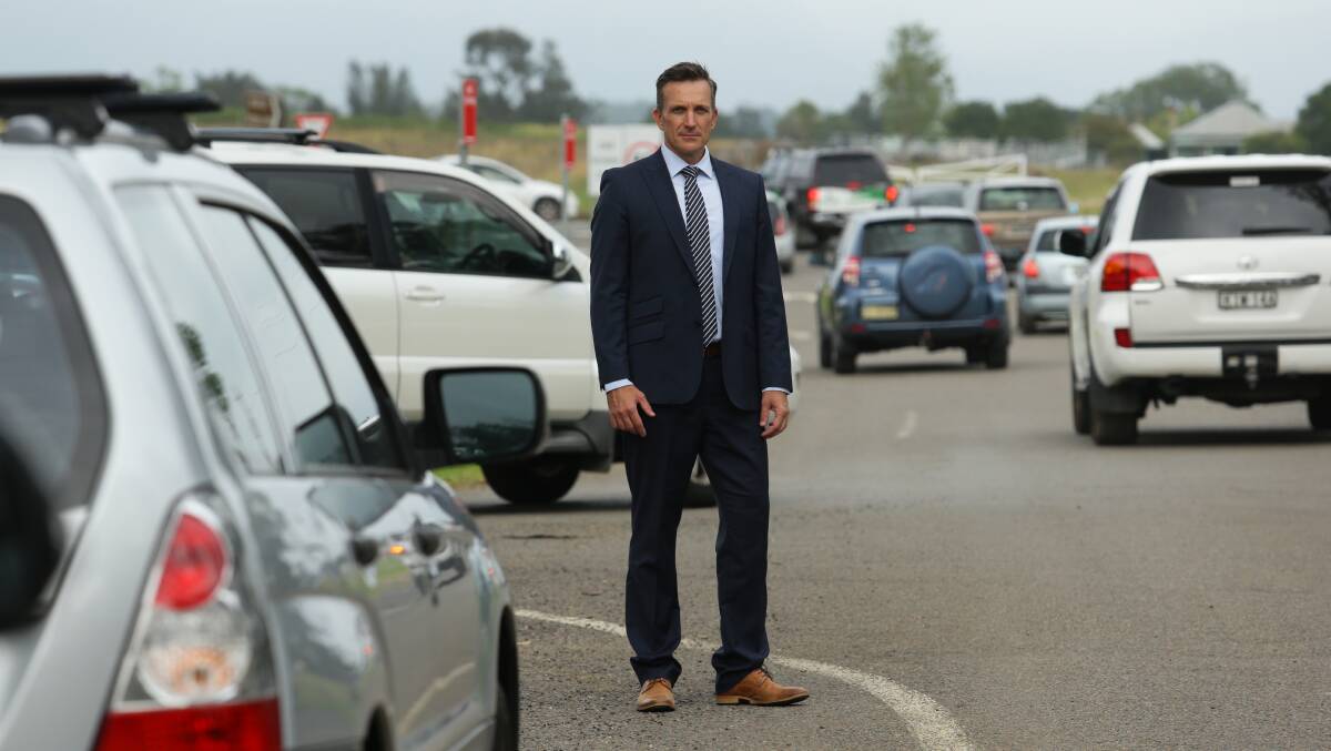 St Philip's principal Darren Cox among the traffic congestion outside his school. Picture: Jonathan Carroll
