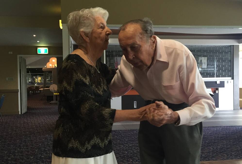 YOUNG AT HEART: Irene Lawson, 90, and Fred Brownlowe, 92, dance at Telarah Bowling Club.