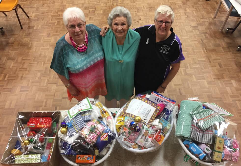 Generosity: Hamper donation organisers Jan Billinghurst and Elizabeth McNally with Carrie's Place CEO Jan McDonald. Picture: Nick Bielby
