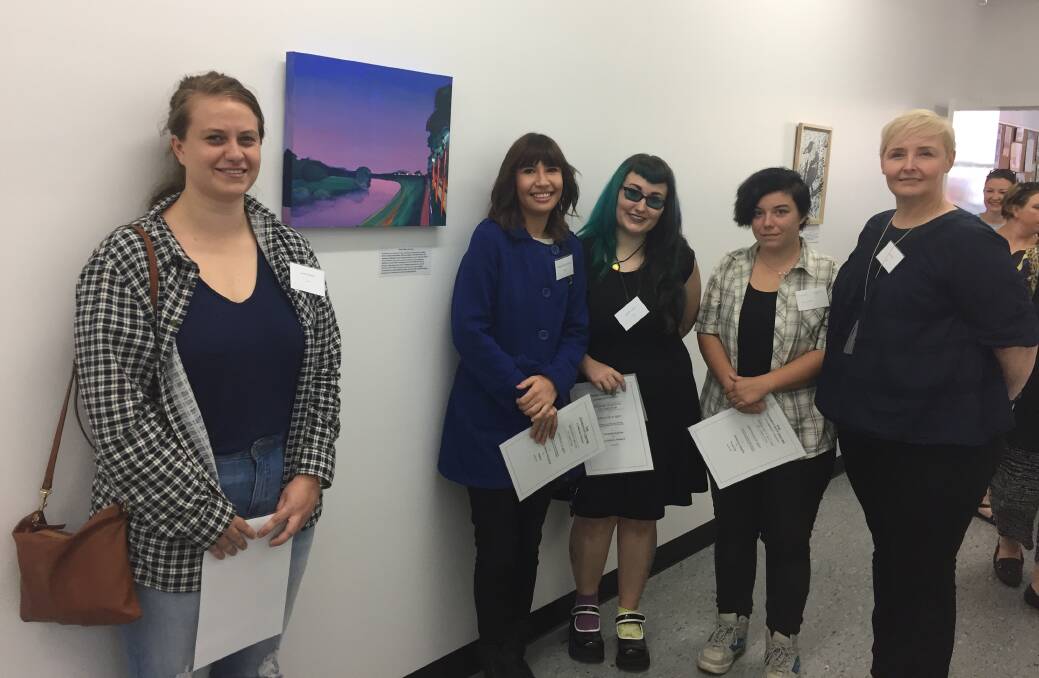 Amber Shipard with her artwork entitled Endearing, with other entrants Brittany Johnson-McLennan, Rochelle Aquilina, Beck Higgins and Leah Riches. Competition winner Brierty Dorahy was absent from the award ceremony.