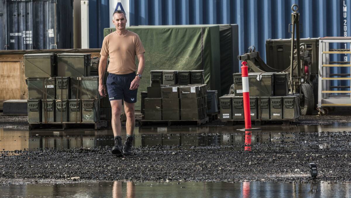 During his Operation OKRA deployment at the main air operating base in the Middle East Region, Royal Australian Air Force Avionics Technician Sergeant Peter Knezevic observes the aftermath of recent rains. Picture: Supplied
 