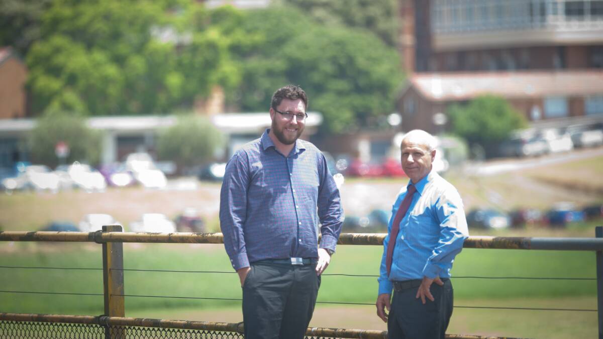 INPUT: NSW Health Infrastructure senior project director Troy Harvey, left, with Hunter New England Health chief executive Michael DiRienzo, at the existing Maitland Hospital site in 2016. Mr DiRienzo will attend the forum on Monday. Picture: Michael Hartshorn