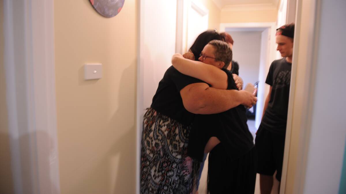 Karin Reynolds and Karen Stackman embrace after Ms Reynolds saw her new-look home for the first time.