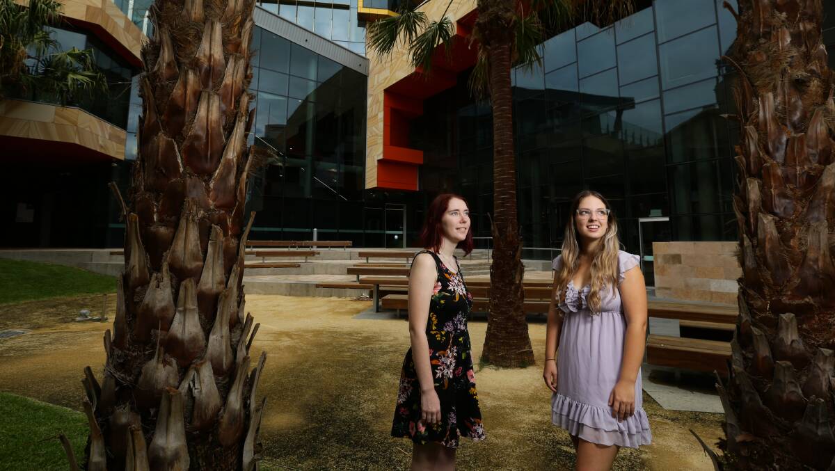 Future plans: University of Newcastle students Olivia Cook and Christy Mullen say finding work in the field they studied would be the driving force behind whether they stay or leave the region. Picture: Jonathan Carroll 