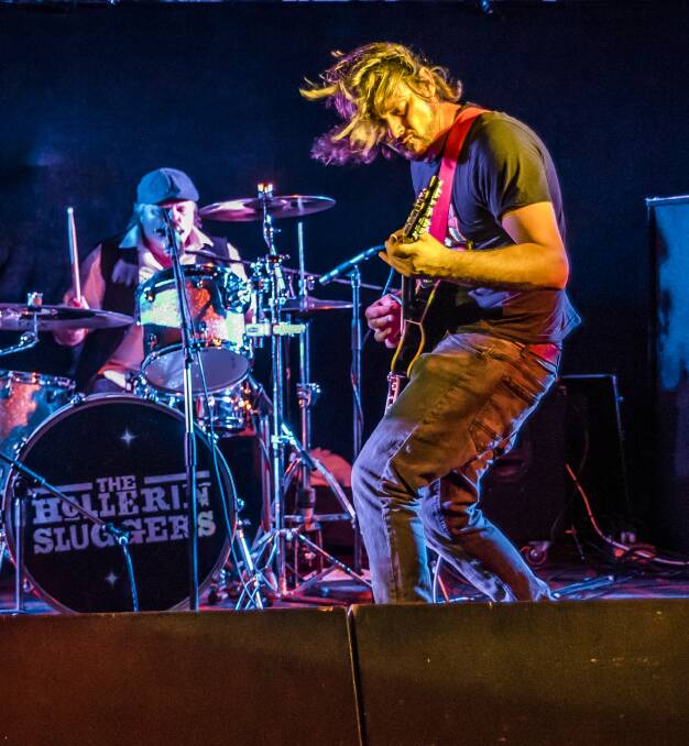 Live and loud: The Hollerin Sluggers' drummer Andy Thor and guitarist Owen Mancell in action. Picture: Supplied