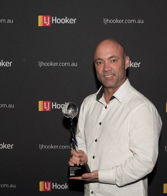Recognition: LJ Hooker Home Loans Hunter owner Ben Eick with his award. Picture: Supplied