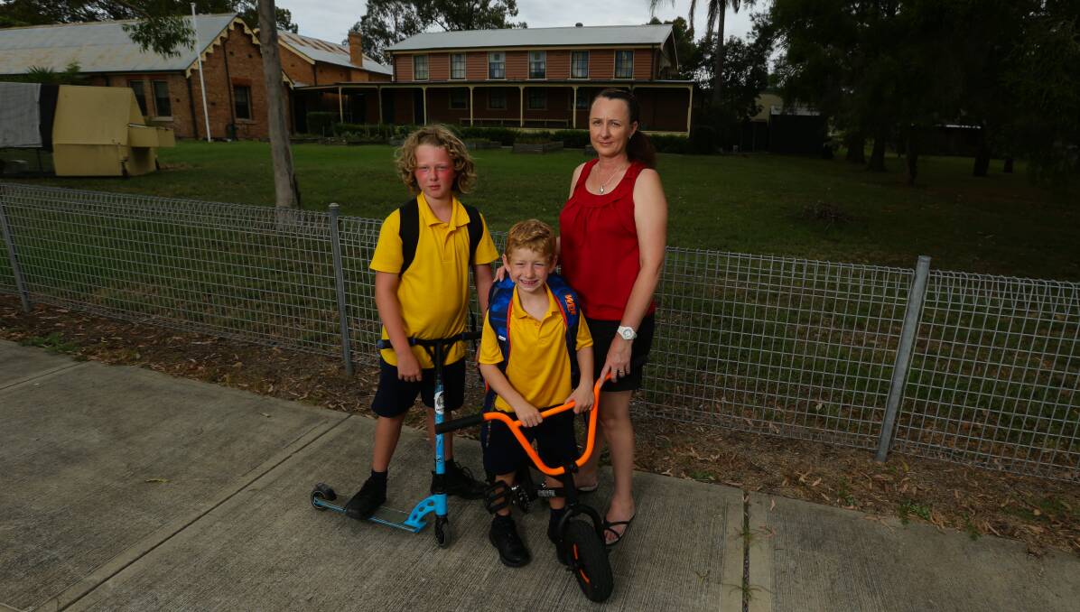 Hard call: Cindy Baker with her sons Kayden (left) and Cameron (right) who now go to Largs Public School. Picture: Jonathan Carroll