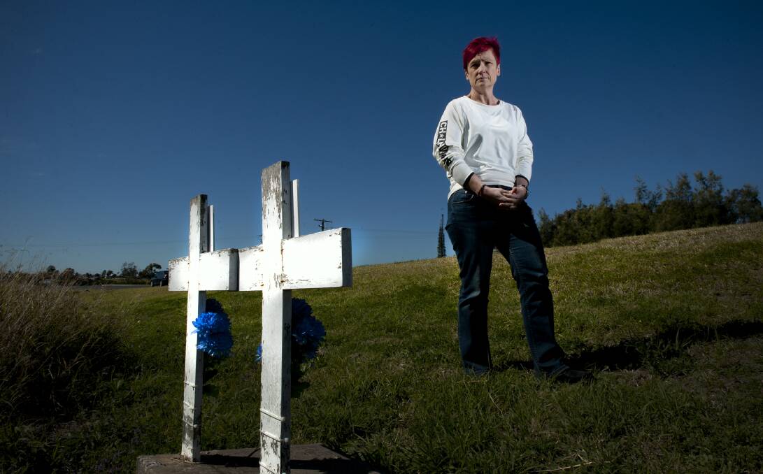 PAYING TRIBUTE: Maitland woman Michelle Davis at Morpeth, near the site of the crash that killed her sons in 2005. Picture: Perry Duffin